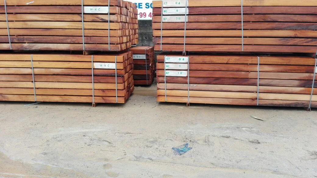 Premium Iroko wood bundles with quality control labels at Douala yard